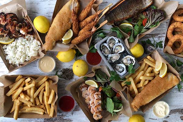 Spread of seafood including fish and chips