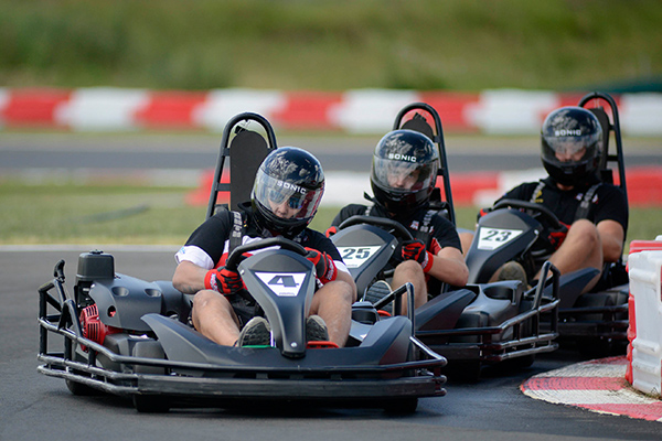 Go karts racing on track