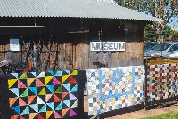 Patchwork quilts displayed in the sun