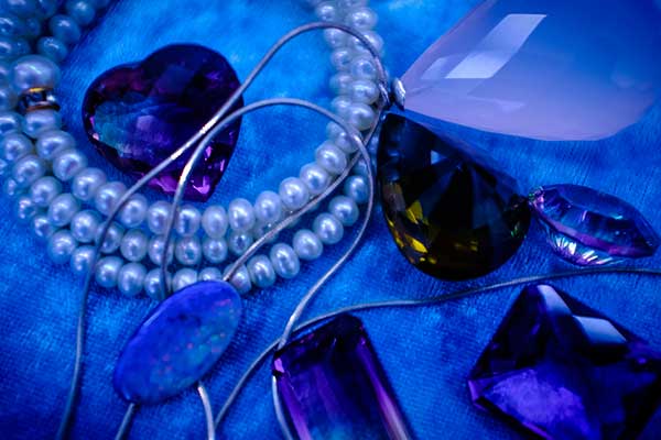 Various gemstones on blue background