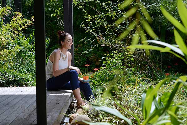 Woman on veranda overlooking Penrith Reginal Gallery's Garden