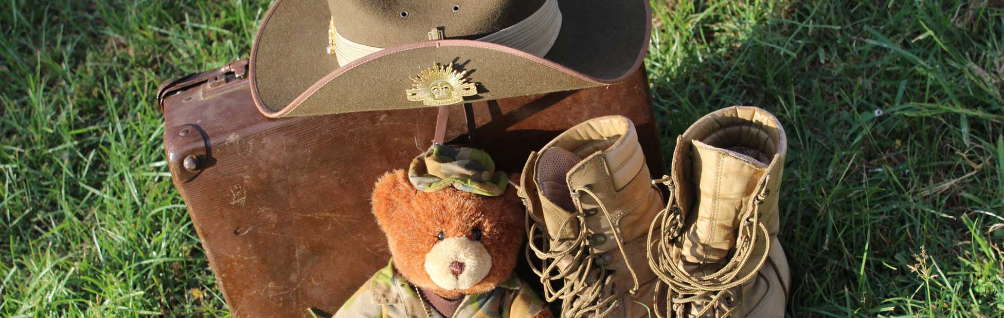 Army hat, boots and bear