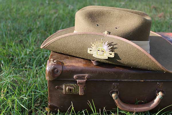 Army hat on suitcase