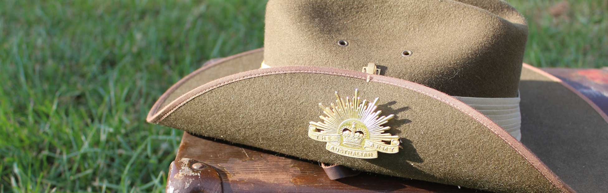 Army hat on suitcase