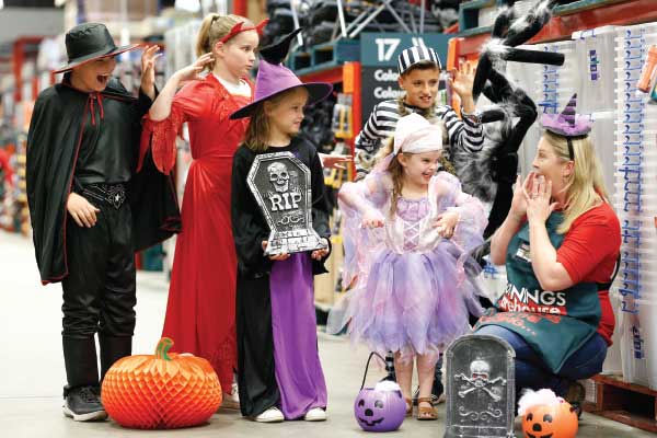 Children in Halloween costumes scaring Bunnings staff member