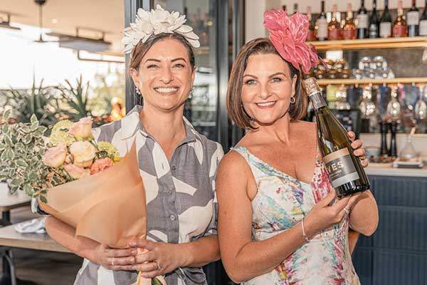 women dressed up in front of bar on Mothers day