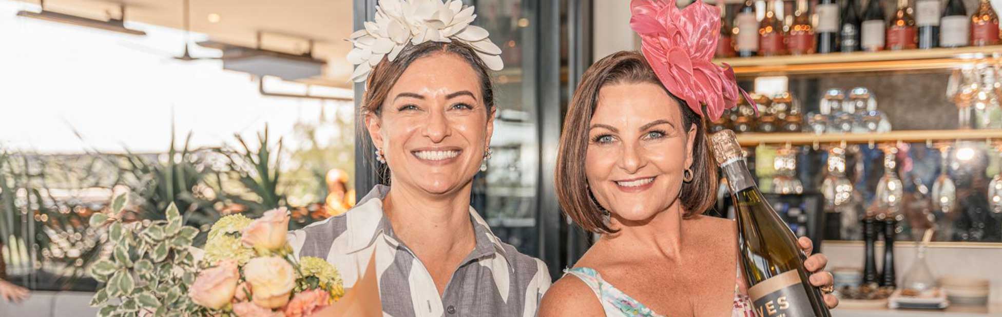 women dressed up in front of bar on Mothers day