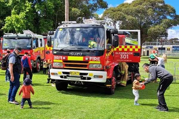 Fire truck surrounded by families