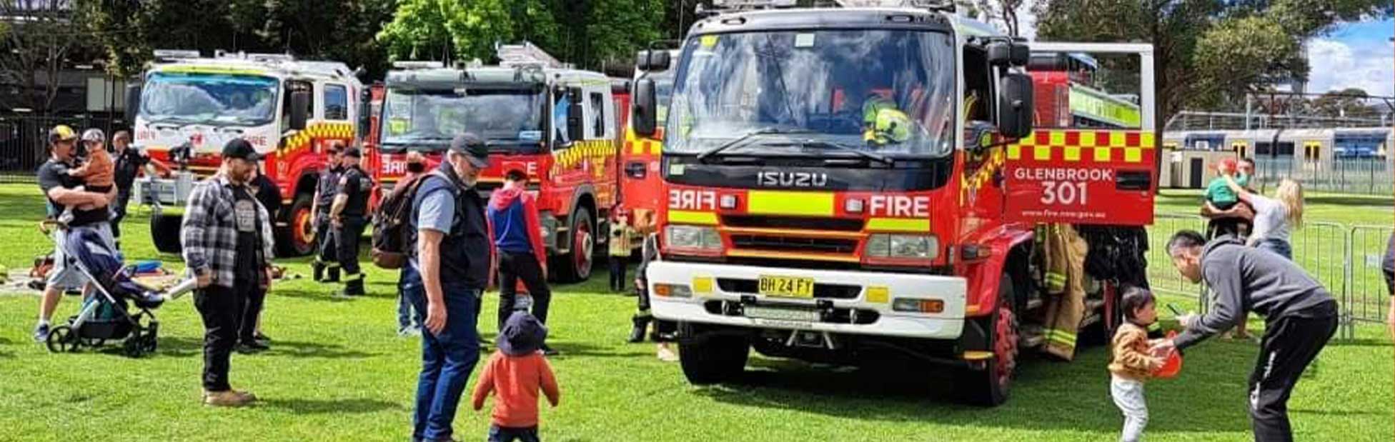 Fire truck surrounded by families