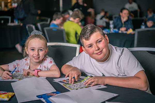 Boy and girl playing bingo