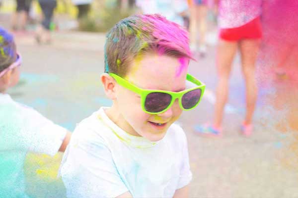 Boy doing colour run