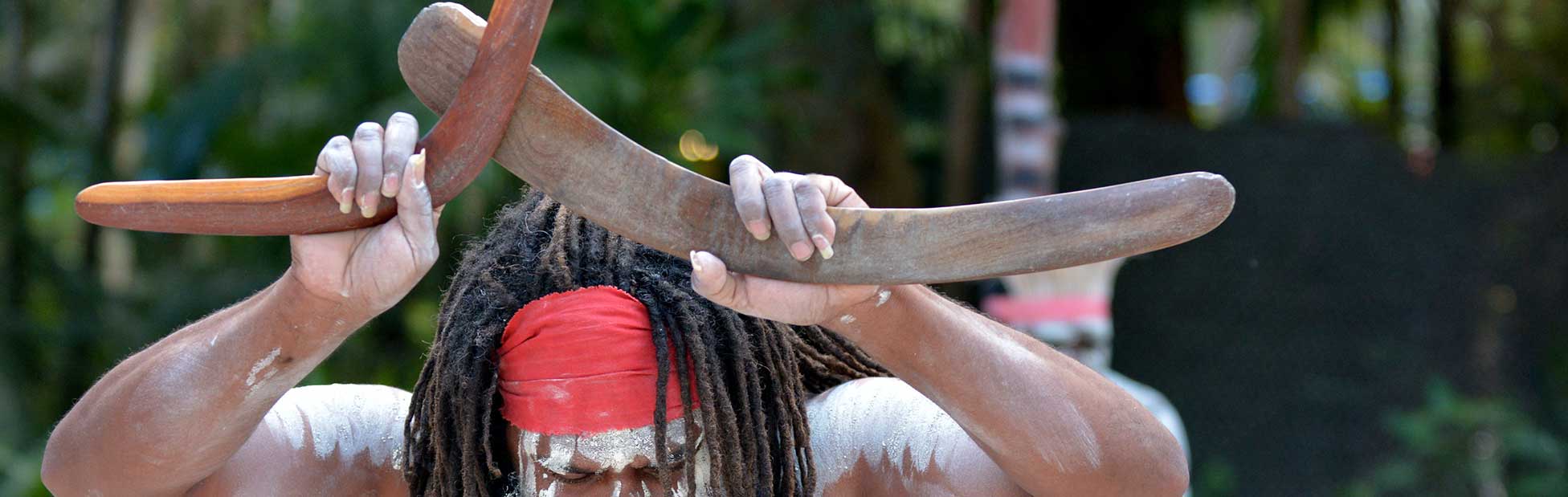 Aboriginal dancer holding boomerangs