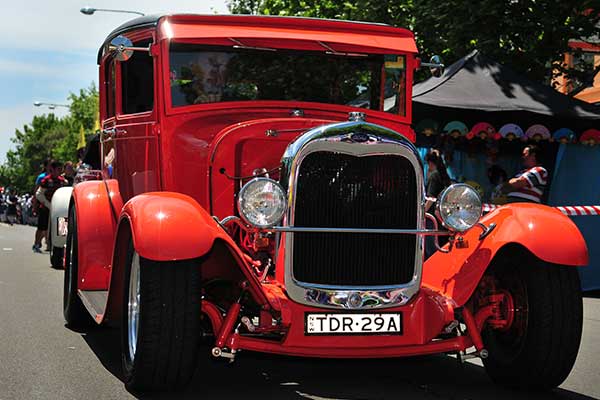 Historic red car in grand parade