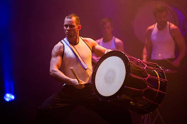 Man playing drum on stage