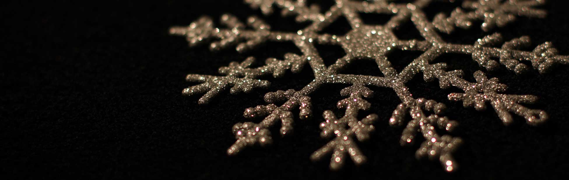 Sparking snowflake style cChristmas decoration on black background