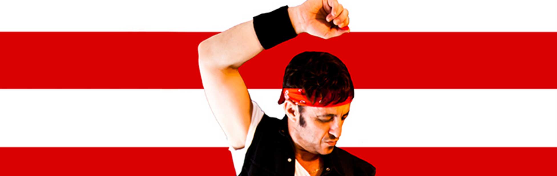 Bruce Springsteen tribute artist hand up in front of red and white stripes