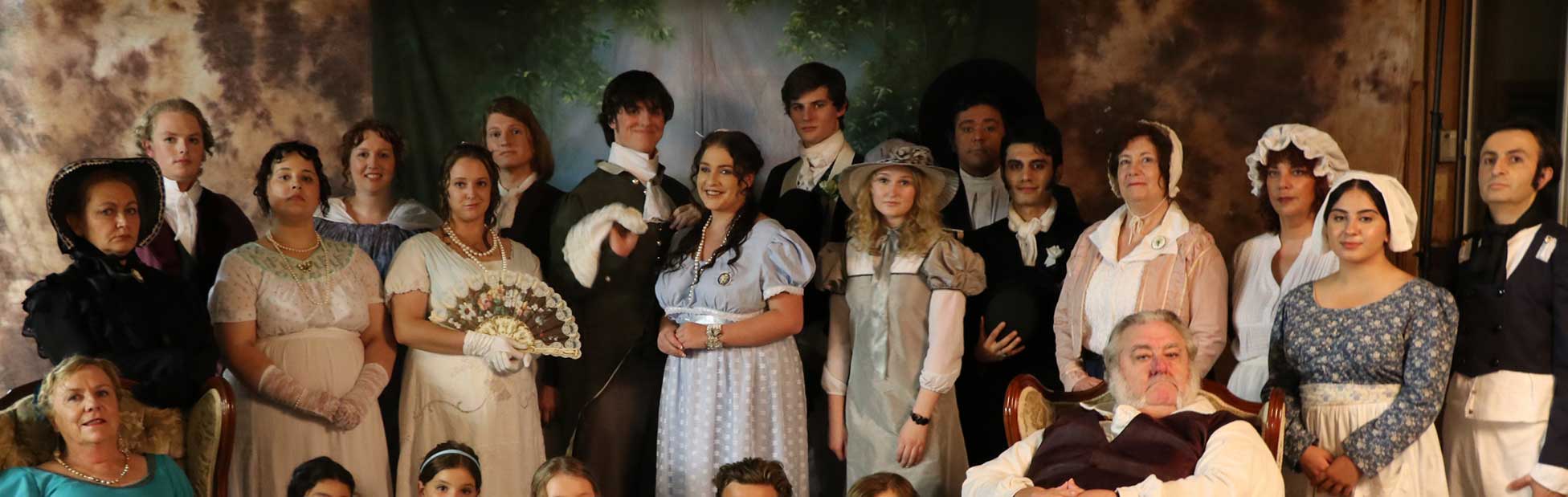 Cast of Mansfield Park posing for photo wearing old fashioned clothing