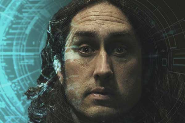 Close up of Ross Noble with confused look on his face
