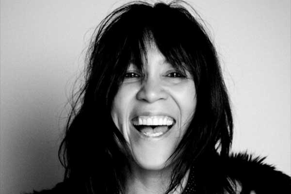 Close up black and white image of Kate Ceberano laughing