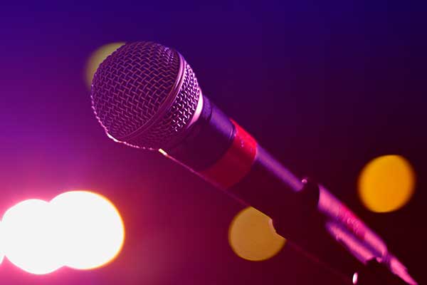 microphone surrounded by stage lighting