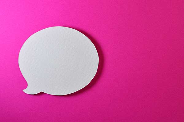 white speech bubble on pink background