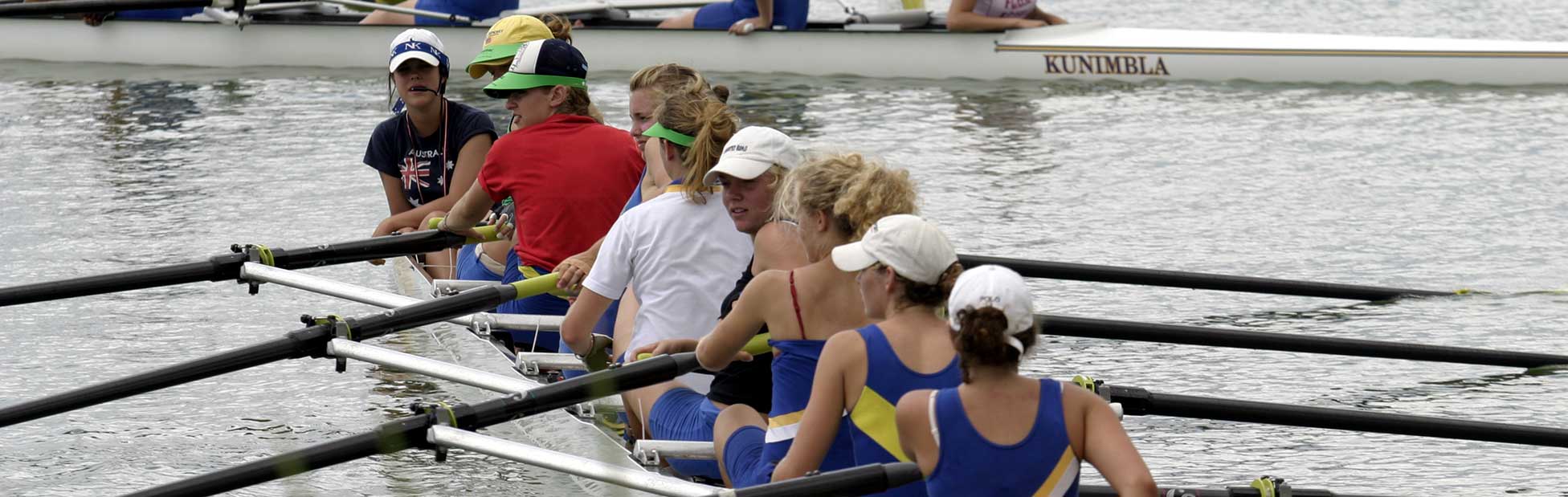 Female teams boarding vessel to compete
