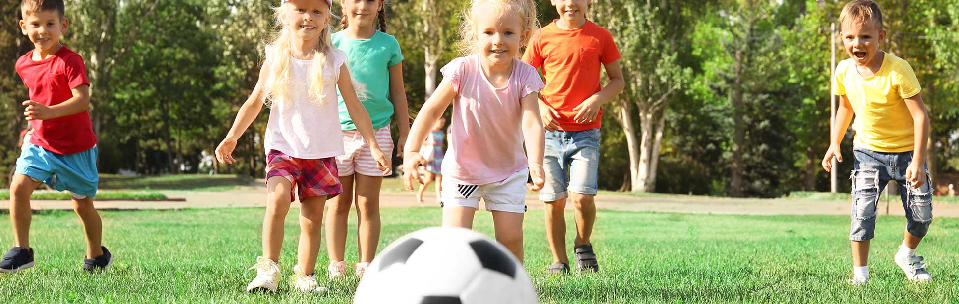 kids chasing soccer ball