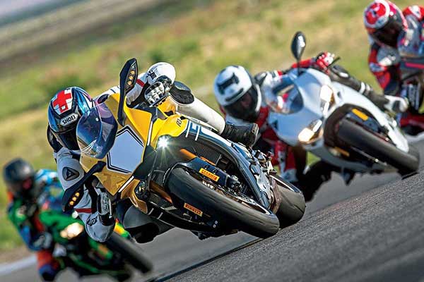 A group of motorbike riders taking a corner