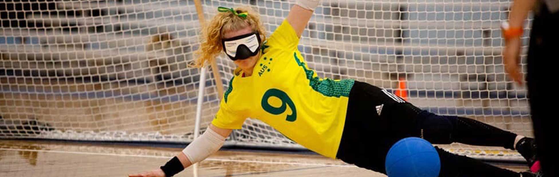 Woman in defending the goal wearing blindfold