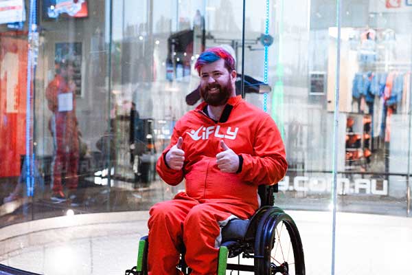 All Abilities Indoor Skydiving Event all abilities pre flight man sitting in wheelchair photo