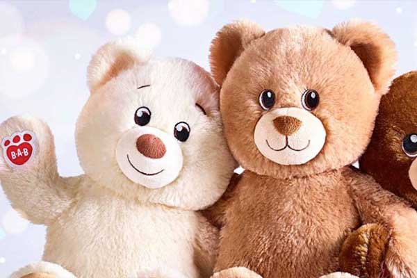 Teddy bears, one waving