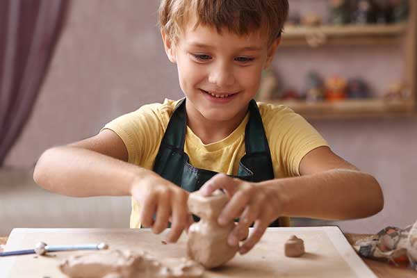 Child playing with clay