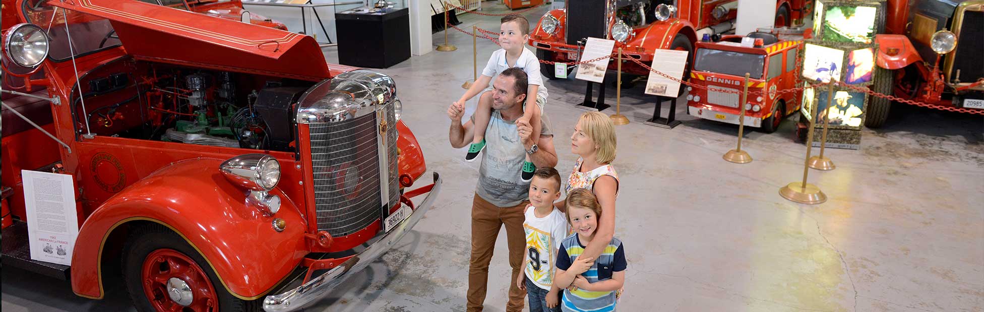 Family looking at fire truck