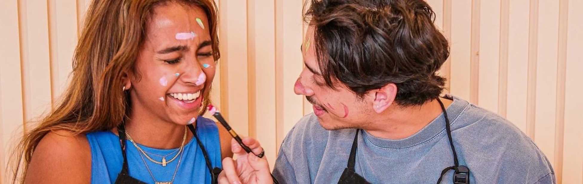 couple painting each other