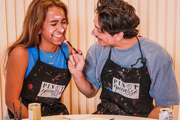 couple painting each other