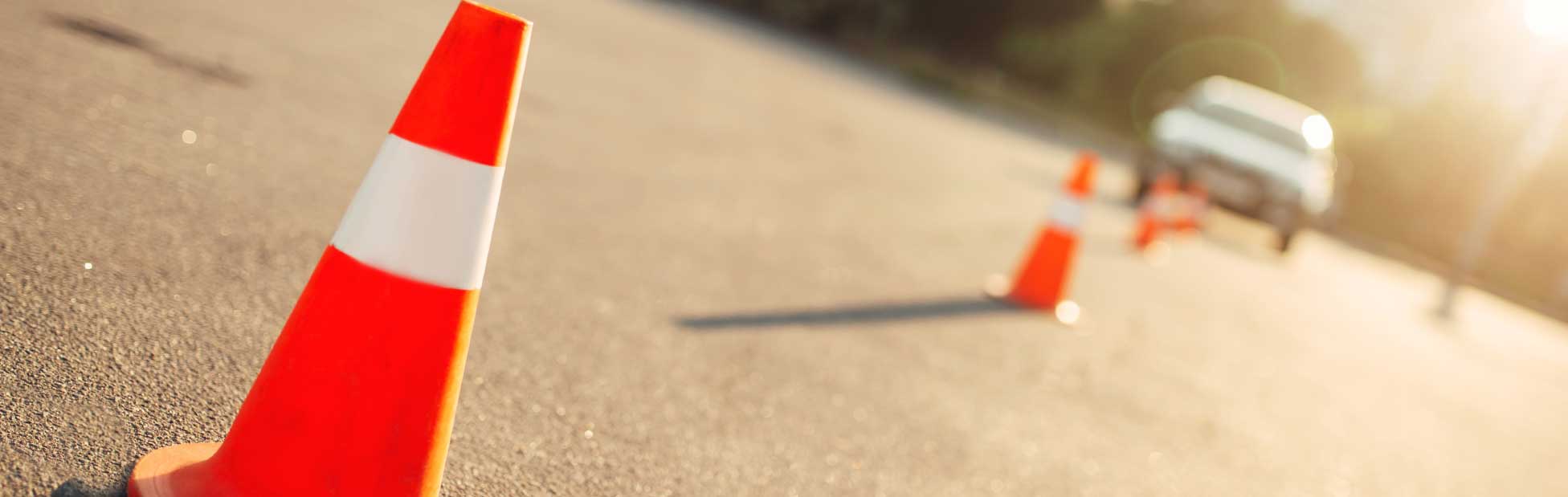 Car driving around cones