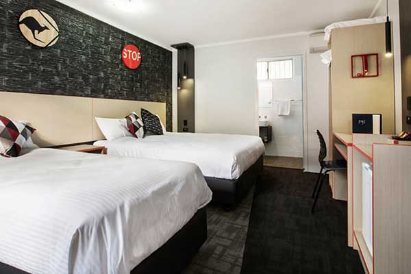 Hotel bedroom with Aussie road signs as decorative feature