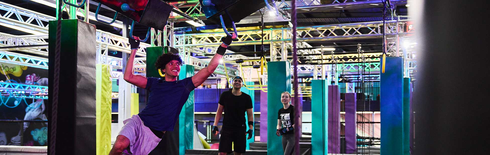 Indoor Activities young man at Tru Ninja friends watching