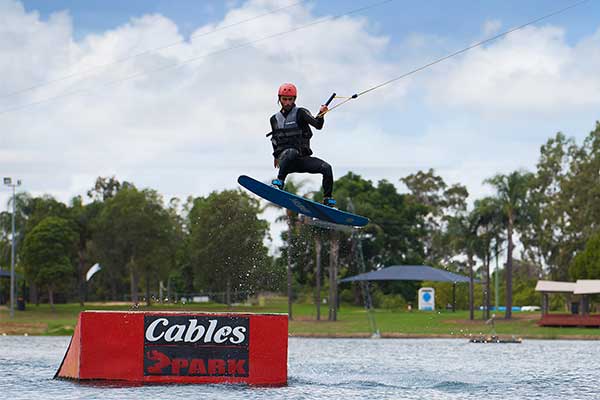 Young lady wakeboarding.