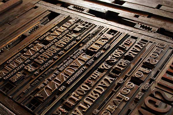 Various letter and number presses lined up for printing