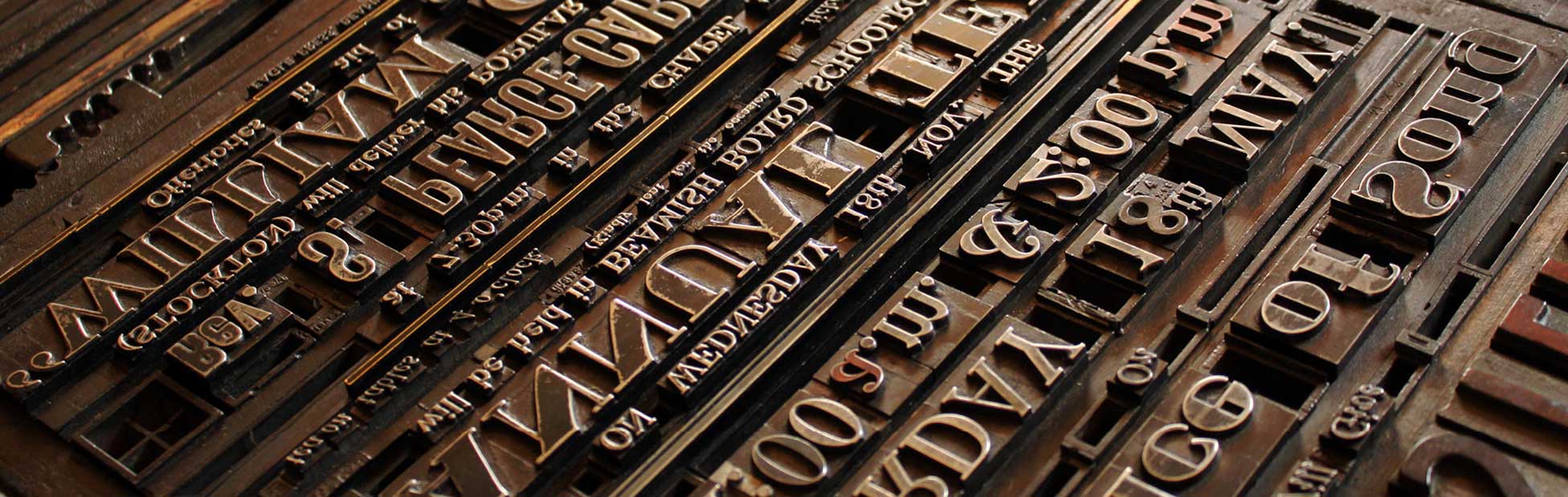 Various letter and number presses lined up for printing