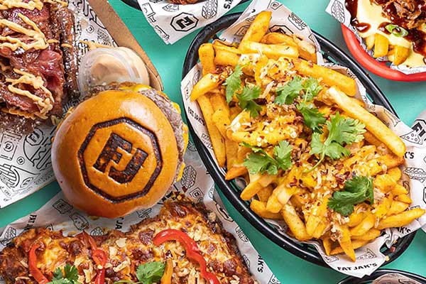 Spread of burgers, loaded fries and schnitzels