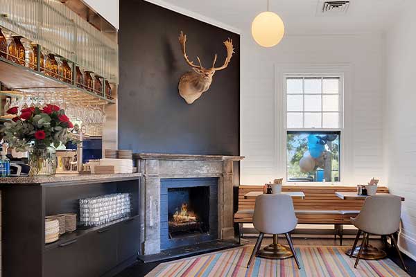 inside cafe near bar and fire
