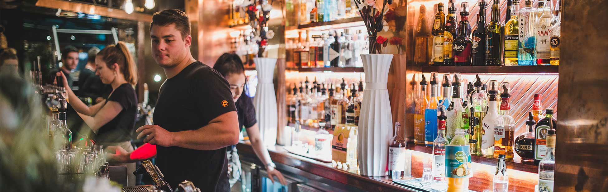 Bartenders serving and mixing drinks