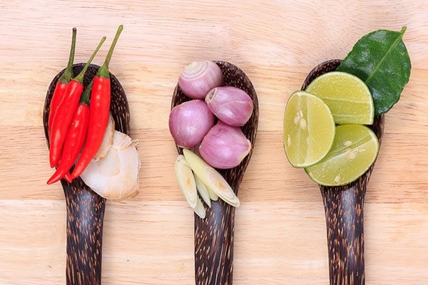 Chillis, onions and lime in bowls