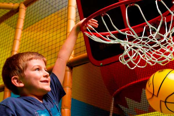 Boy shooting basketball